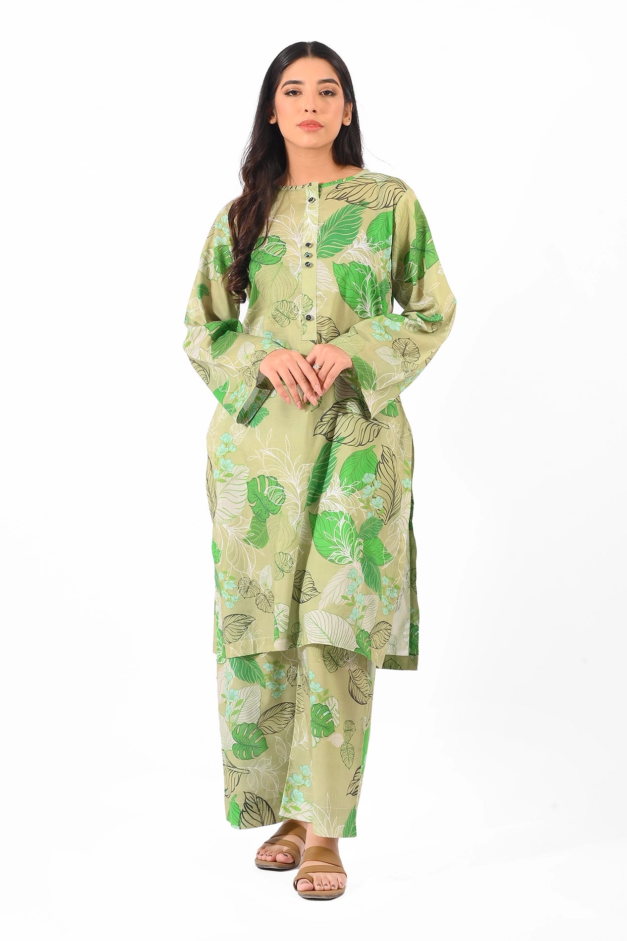 Full view of a model wearing a green printed two-piece outfit featuring leafy patterns.
BOLDSTEP BOLDSTEP.PK