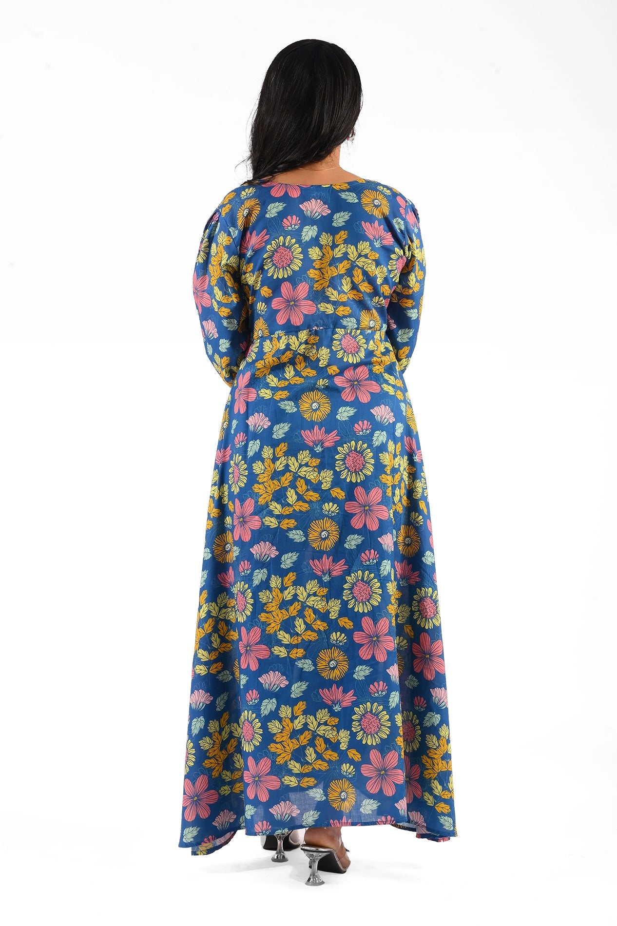 Back view of the floral printed maxi dress, displaying its seamless, flowing design and vibrant patterns of yellow and pink flowers on a blue base. BOLDSTEP BOLDSTEP.PK