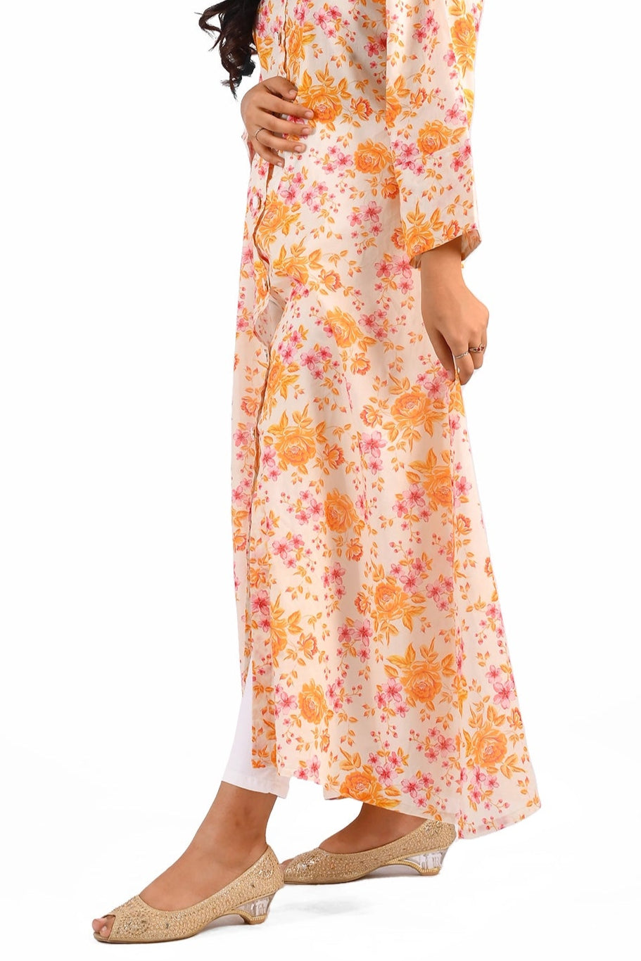 Side view of the same floral dress, showcasing its length and design details, with the model posing elegantly. BOLDSTEP BOLDSTEP.PK
