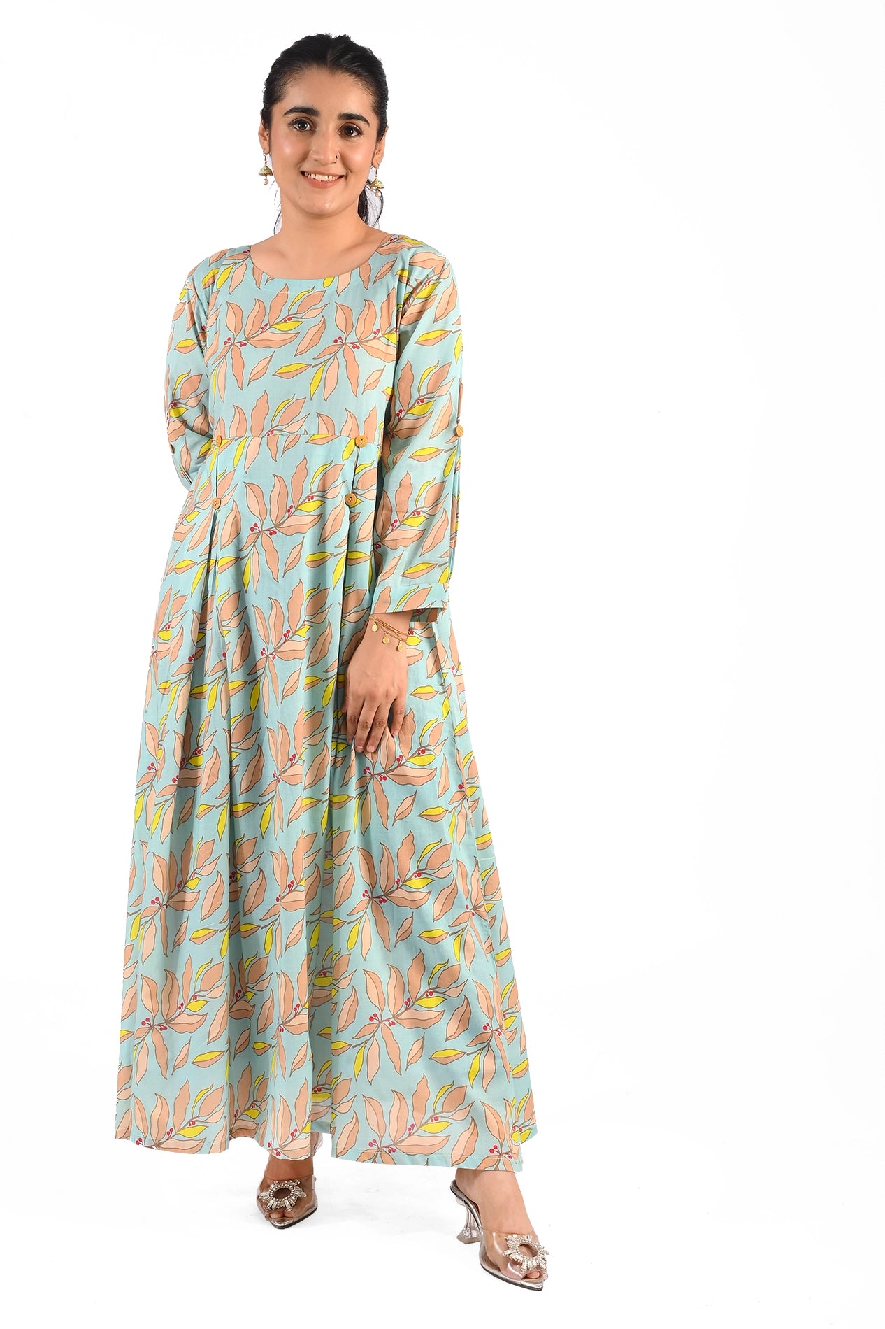 front view of the aqua blue maxi dress, emphasizing the delicate leaf pattern, button-down details, and the model's matching gold bracelet BOLDSTEP BLDSTEP.PK