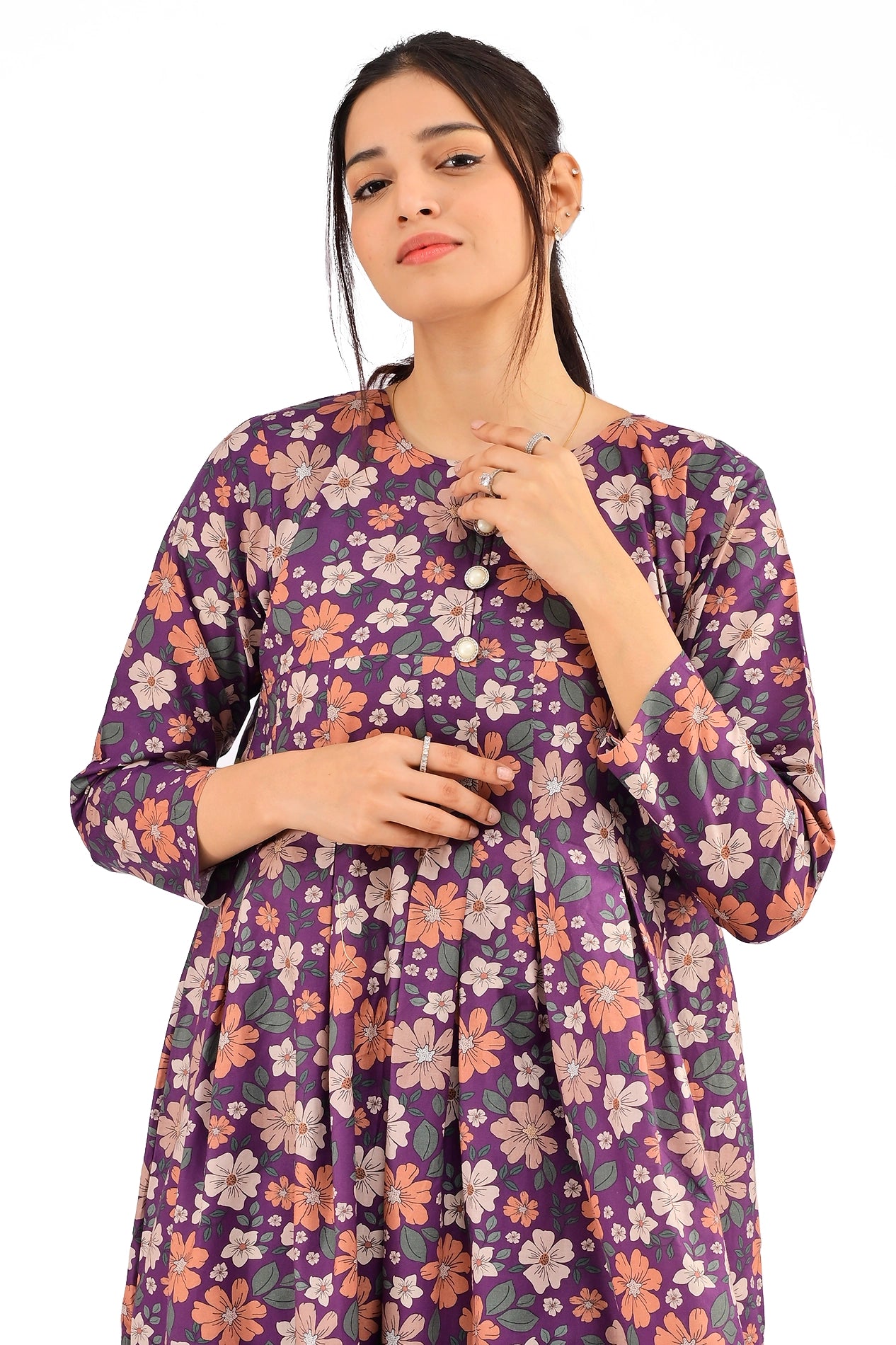 Close-up of the vibrant floral pattern and decorative buttons on the purple maxi dress, highlighting its intricate details. BOLDSTEP BOLDSTEP.PK