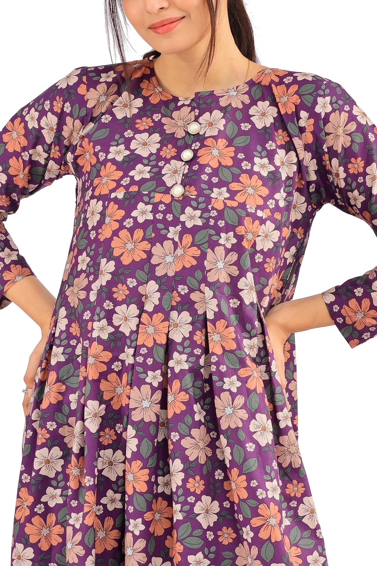 Detailed view of the pleated design and floral accents on the purple maxi dress, paired with black heels. BOLDSTEP BOLDSTEP.PK