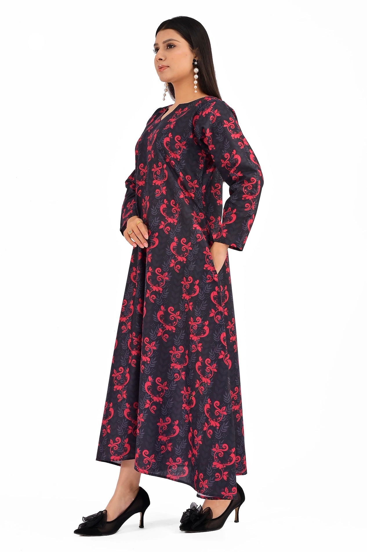 Side profile of a black dress showcasing a bold red floral pattern and integrated side pockets, with a flowing A-line silhouette. BOLDSTEP BOLDSTEP.pk