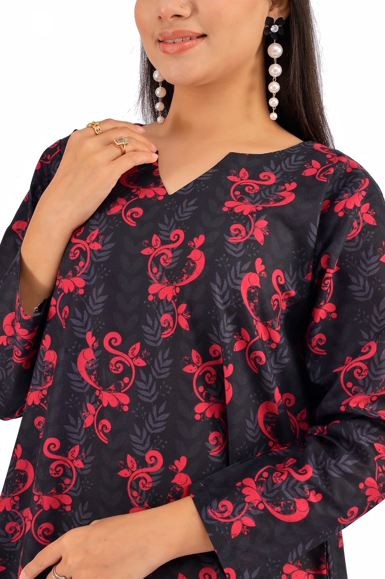 Detailed close-up of the red floral pattern on a black dress, highlighting the vibrant design and fabric texture. BOLDSTEP BOLDSTEP.PK