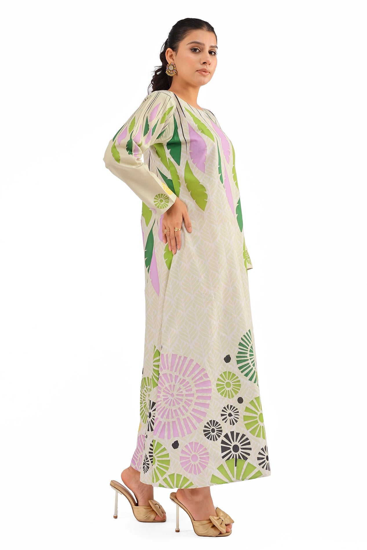 Side profile of the beige maxi dress, showcasing long sleeves with delicate floral accents and a relaxed, flowing silhouette.
BOLDSTEP BOLDSTEP.PK