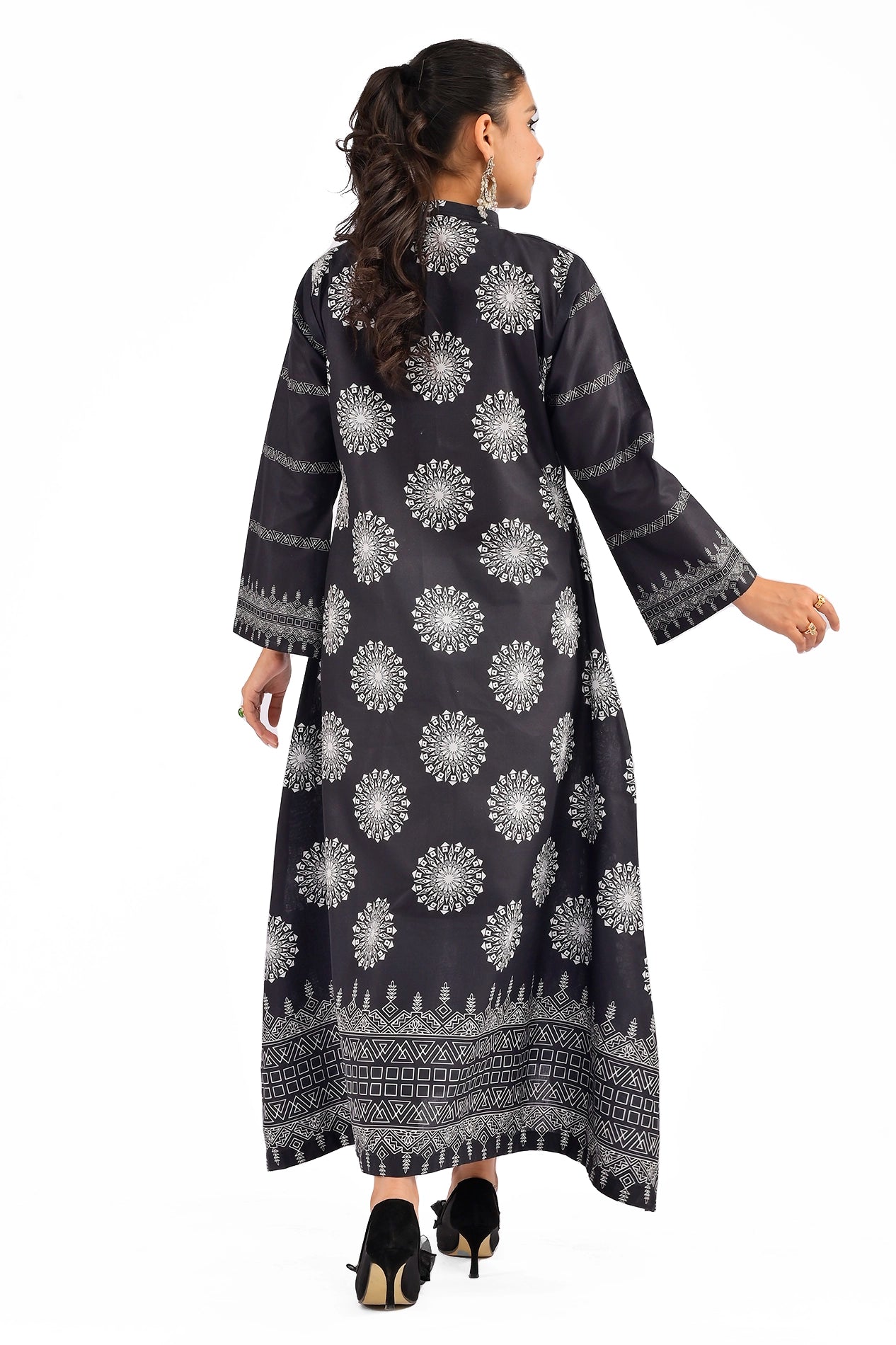 Back view of a black dress adorned with medallion motifs and bordered hemline patterns, showcasing a clean and structured look. BOLDSTEP BOLDSTEP.PK