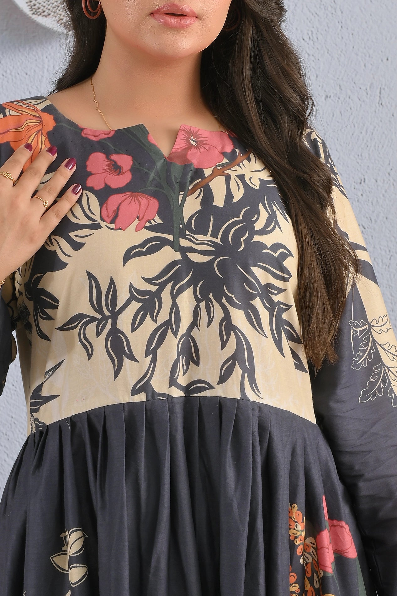 Close-up of neckline and floral print details on BOLDSTEP premium cotton maxi dress, beige and black two-tone design with red floral accents – BOLDSTEP.PK collection