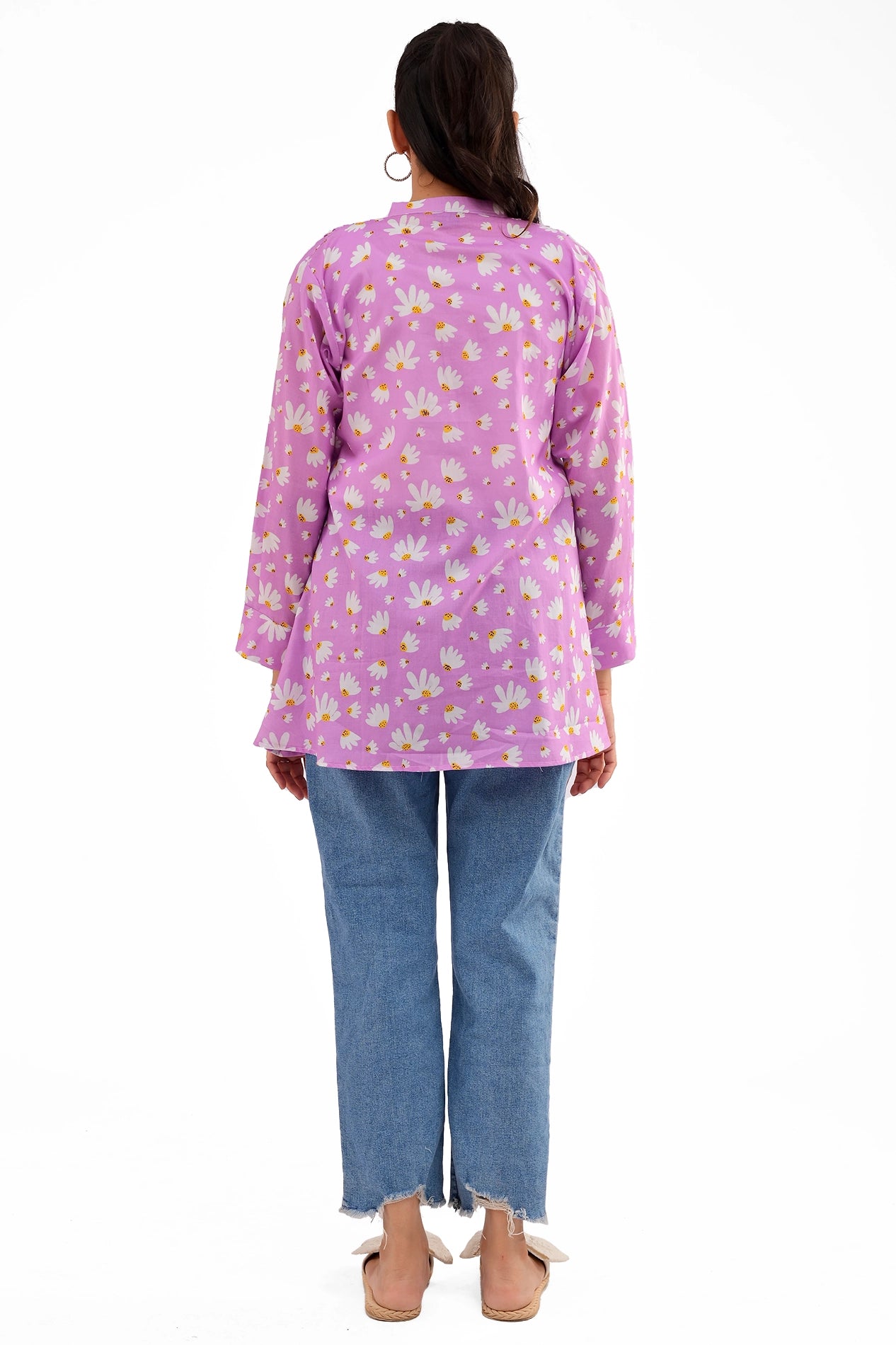 A back-angle shot of the model in the lavender tunic, showing the comfortable fit and floral design extending throughout