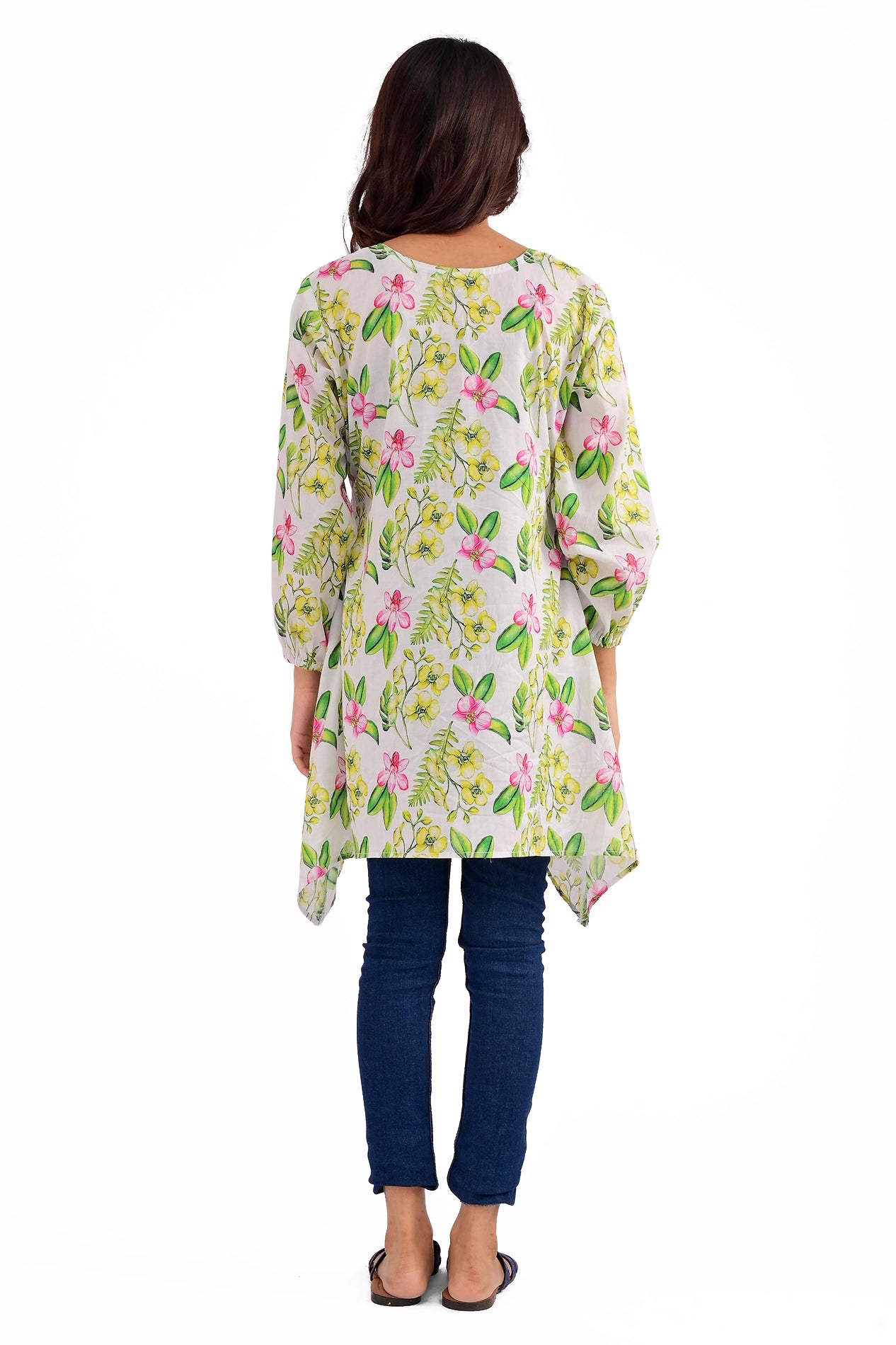 Back view of the floral tunic, displaying its detailed pink and yellow floral pattern with green leaves