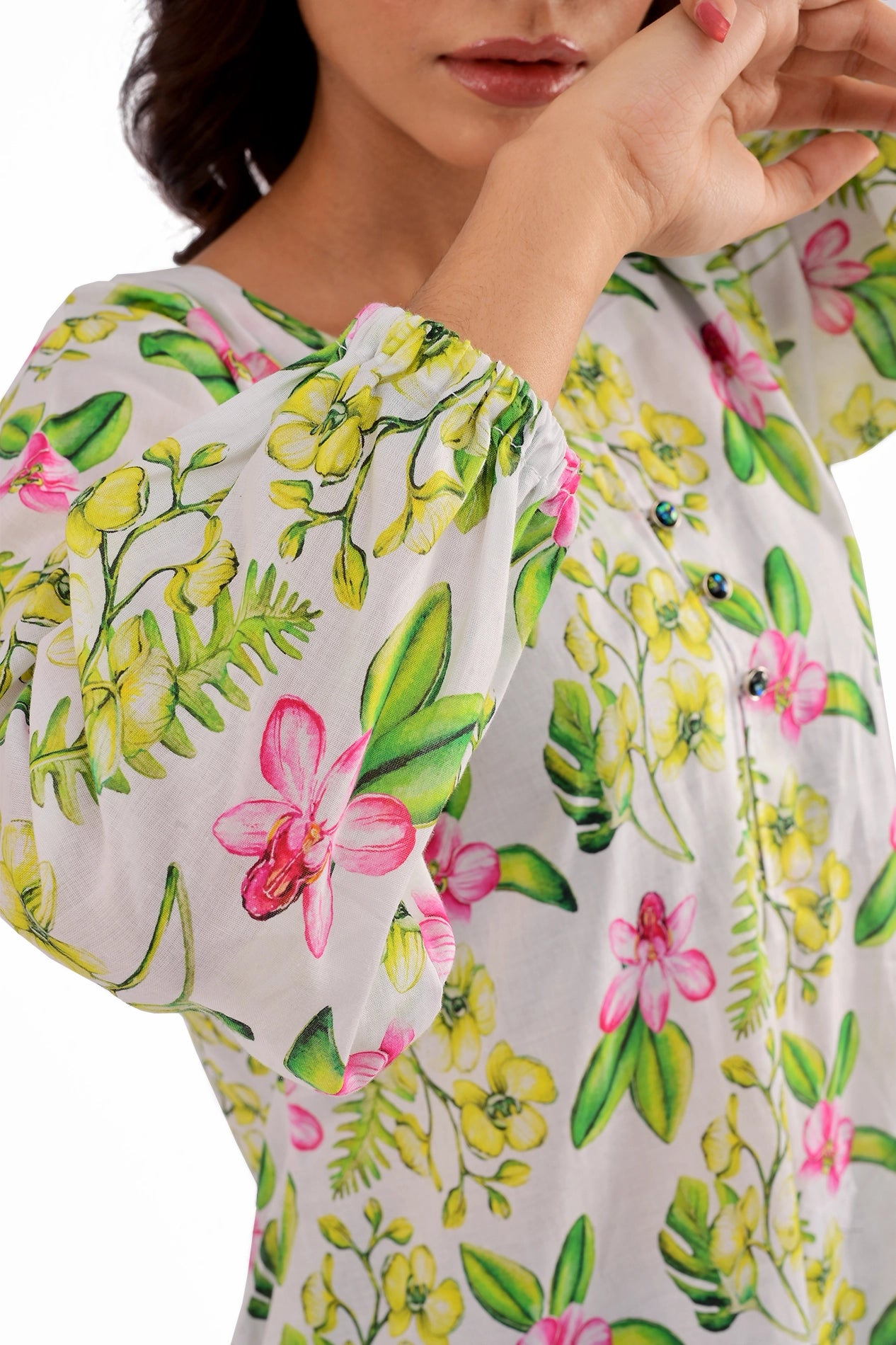 Sleeve close-up of the floral printed tunic, highlighting the elasticated cuffs and intricate floral pattern