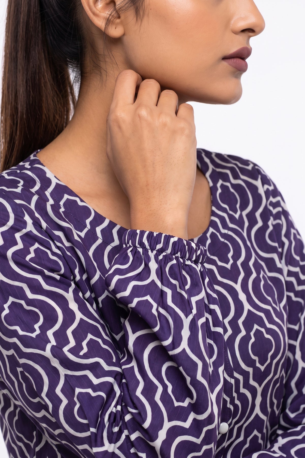Close-up of elasticated wrist cuff on full sleeve of BOLDSTEP purple geometric printed Swiss Bana Dora dress.