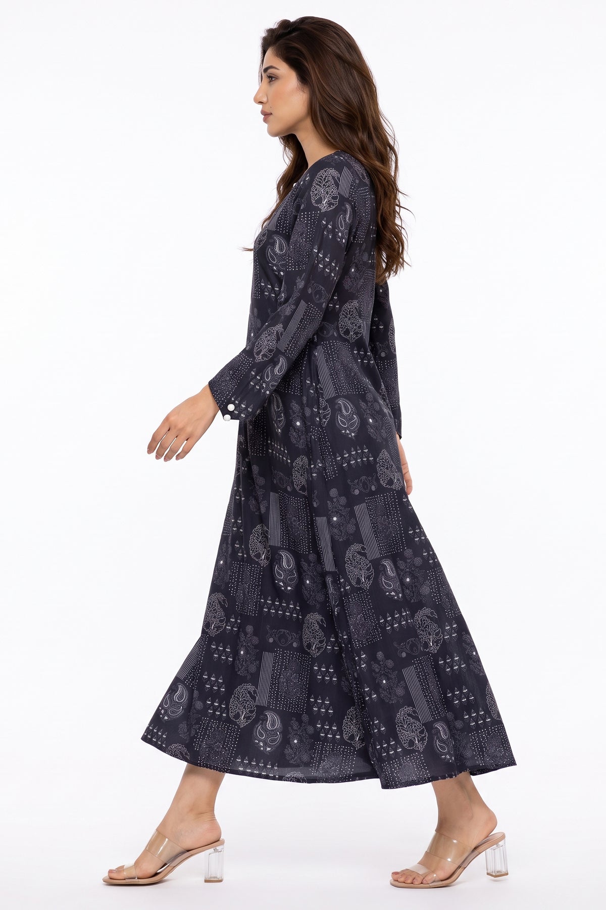 Side profile view of BOLDSTEP navy blue block-printed paisley winter maxi dress in motion.