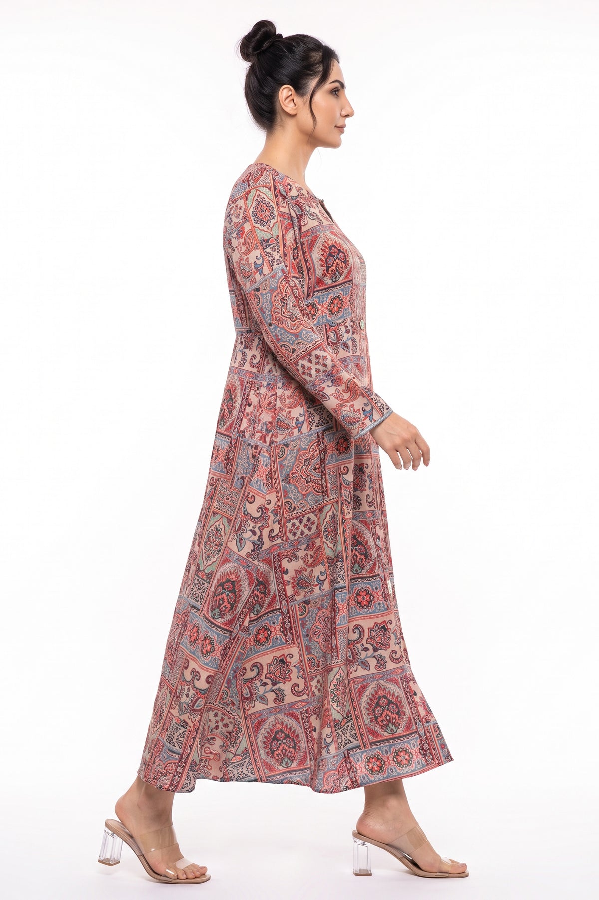 Side profile view of BOLDSTEP beige mosaic tile paisley printed winter maxi dress in motion.