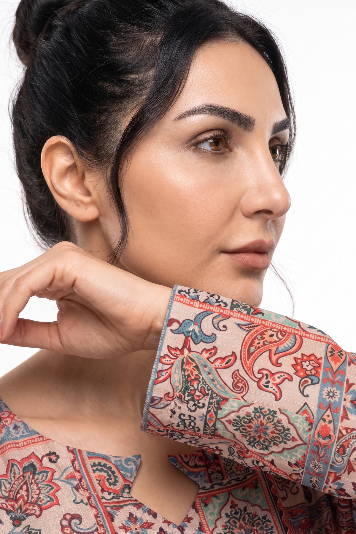 Close-up of printed sleeve cuff on BOLDSTEP beige mosaic tile Swiss Bana Dora maxi dress.