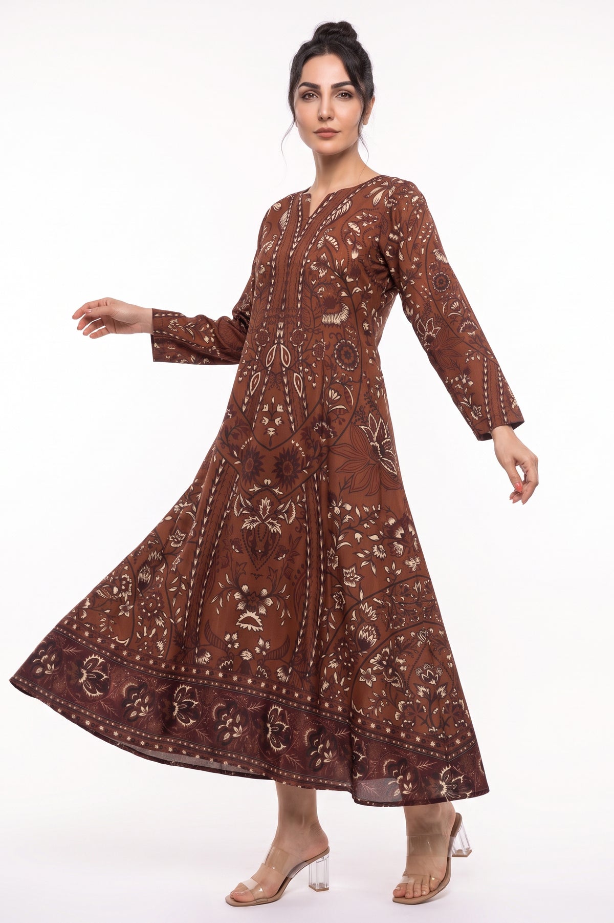 Front full-length view of BOLDSTEP Rust Brown Batik Motif Swiss Bana Dora Maxi Dress in motion.