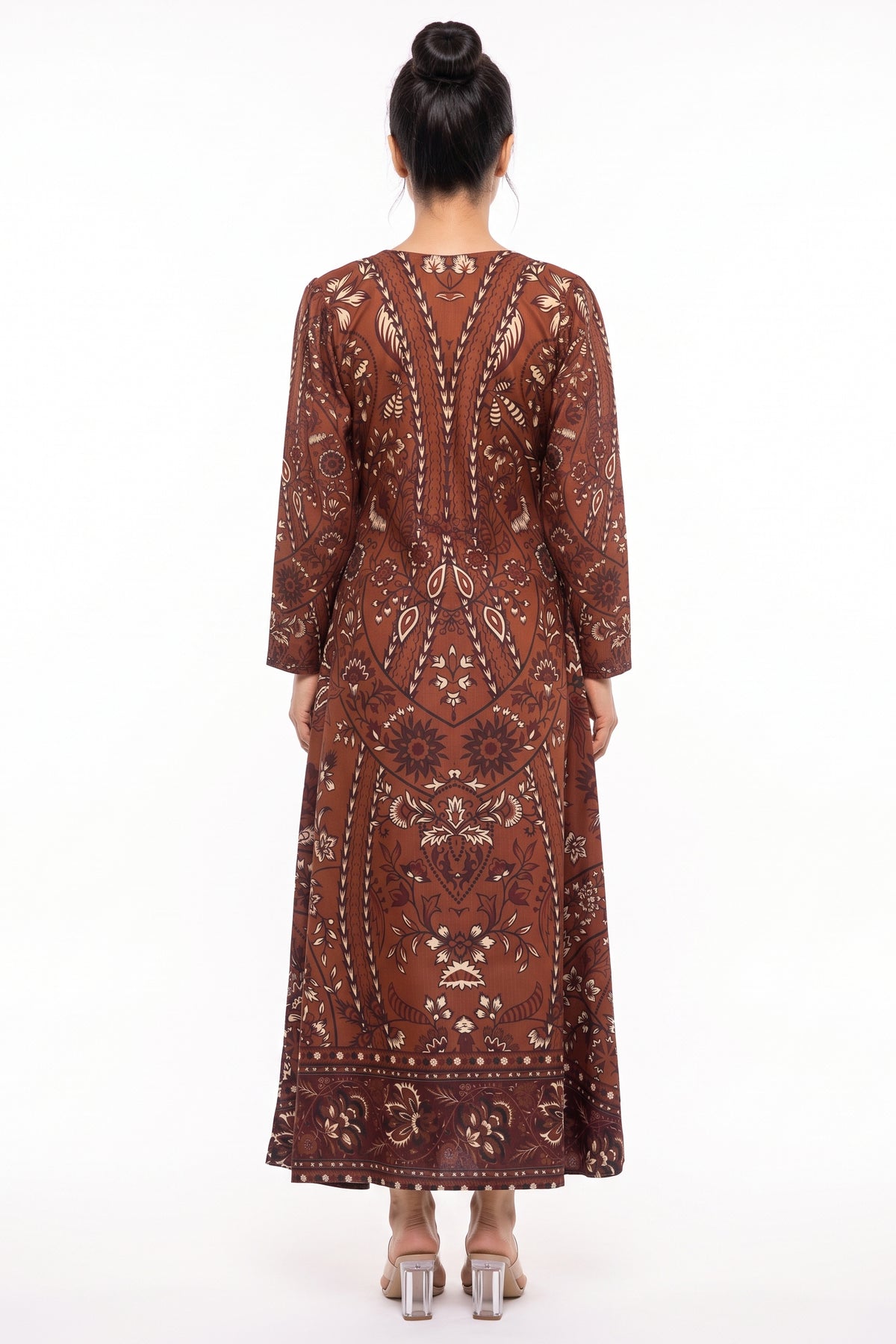 Back full-length view of BOLDSTEP rust brown batik printed Swiss Bana Dora winter maxi dress.