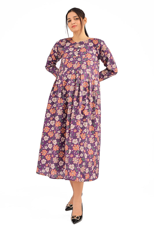 Model wearing a vibrant purple floral maxi dress with full sleeves and decorative buttons, styled with black heels for an elegant look. BOLDSTEP BOLDSTEP.PK