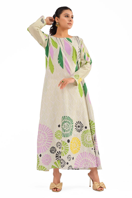 Model wearing a beige maxi dress with green and lavender leaf patterns, round neckline, and vibrant circular floral motifs on the hemline. BOLDSTEP BOLDSTEP.PK