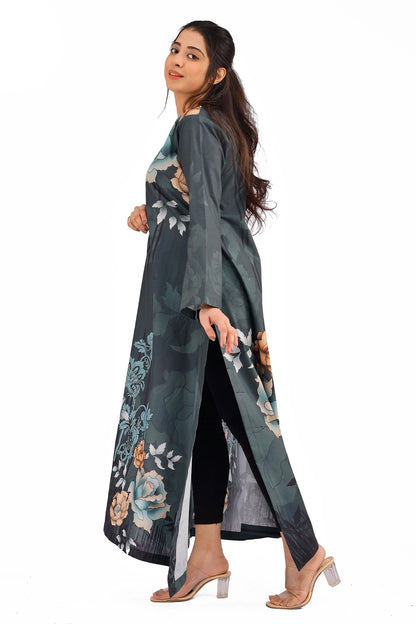 A side profile of the dark slate dress with floral print, showcasing its loose fit, side slit detail, and elegant flow as the model poses with a subtle smile. BOLDSTEP BOLDSTEP.PK