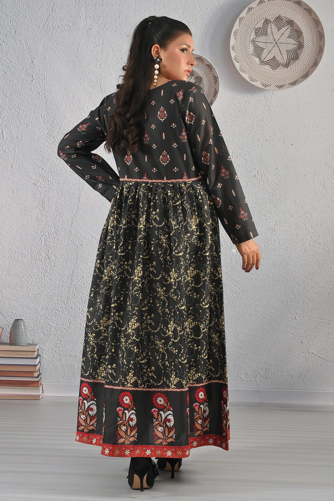 Back view of BOLDSTEP black maxi dress with golden floral print and red border detailing – premium cotton fabric from BOLD STEP | BOLDSTEP.PK | BOLDSTEP STORE.