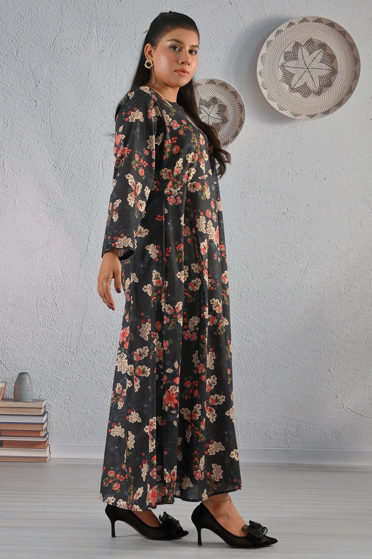 Side view of BOLDSTEP black floral maxi dress with red and cream printed flowers, long sleeves, and soft flare – stylish everyday wear by BOLD STEP | BOLDSTEP.PK | BOLDSTEP STORE.