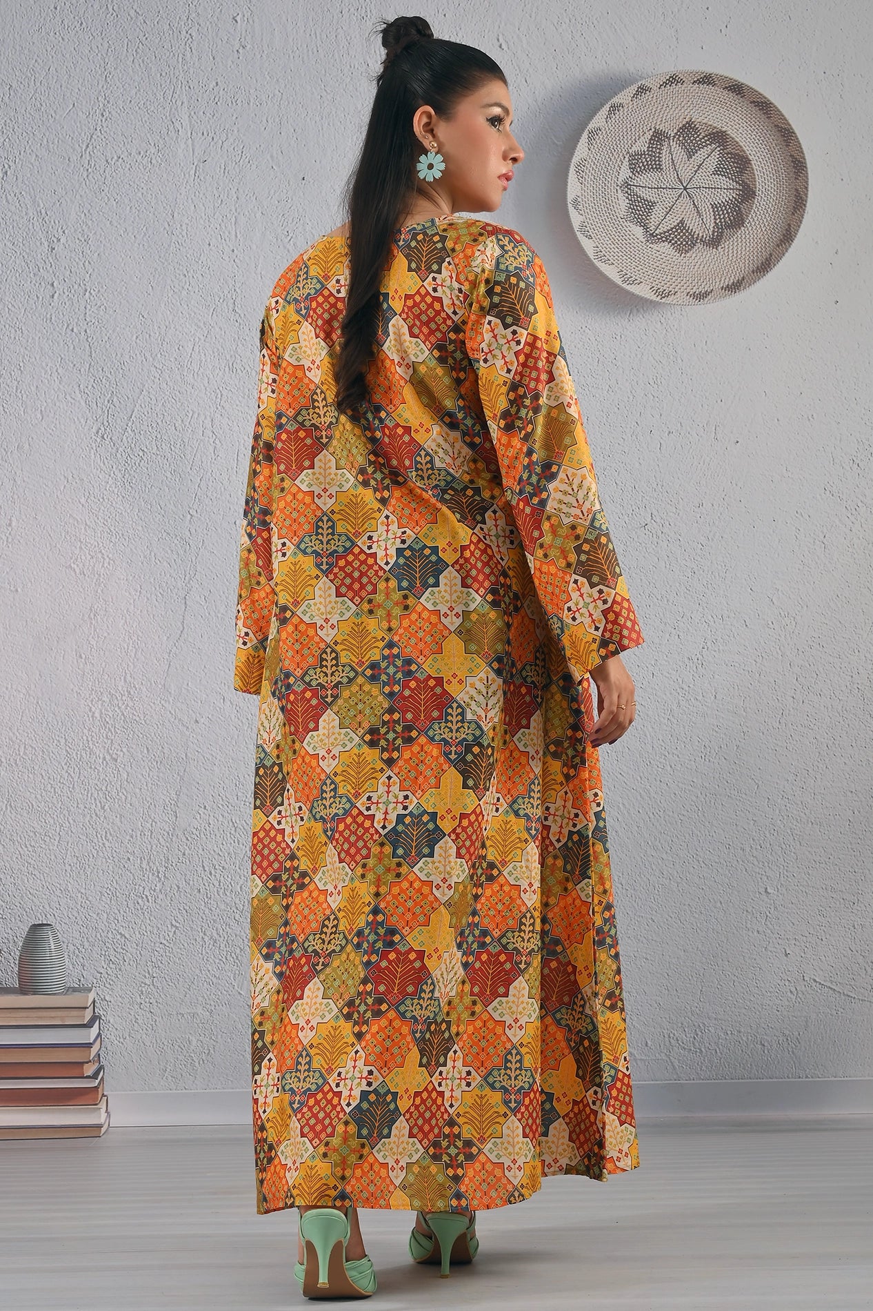 Back view of BOLDSTEP long maxi dress with striking yellow, orange, and red ethnic patchwork print – stylish Pakistani fashion from BOLD STEP | BOLDSTEP.PK | BOLDSTEP STORE.