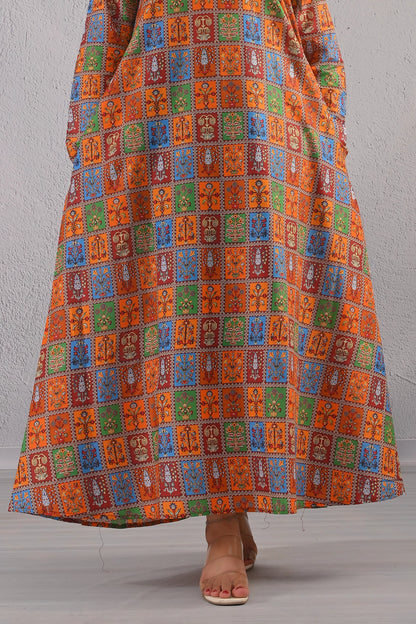 Close-up of BOLDSTEP maxi dress hemline showing detailed orange, blue, green, and maroon ethnic print squares – premium lawn fabric | BOLD STEP | BOLDSTEP.PK | BOLDSTEP STORE.
