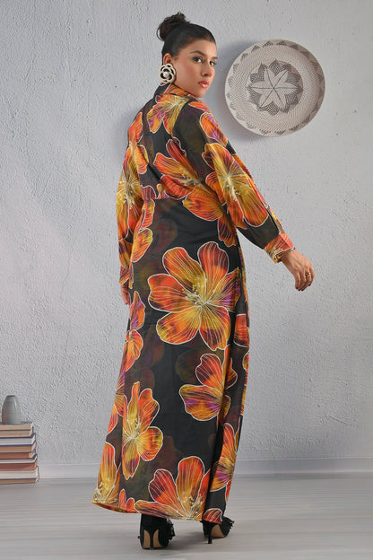 Back view of BOLDSTEP black floral maxi dress featuring large orange and mustard flower prints, full-length silhouette, and elegant fit | BOLD STEP | BOLDSTEP.PK | BOLDSTEP STORE.