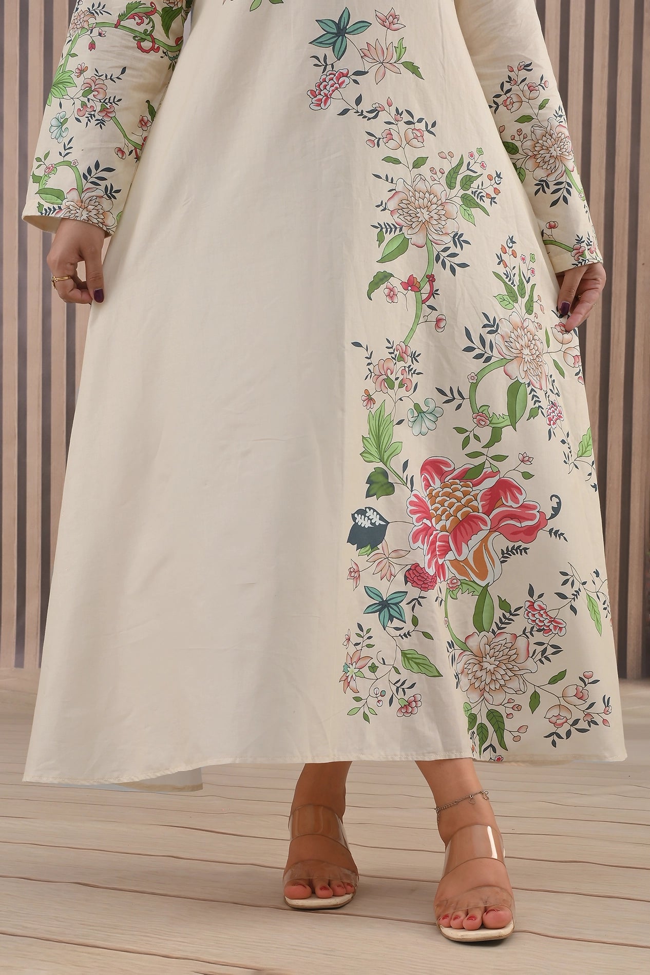 Close-up of floral print detail on lower half of BOLDSTEP cream maxi dress highlighting colorful botanical artwork – premium summer fashion | BOLD STEP | BOLDSTEP.PK | BOLDSTEP STORE.