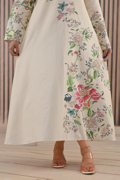 Close-up of floral print detail on lower half of BOLDSTEP cream maxi dress highlighting colorful botanical artwork – premium summer fashion | BOLD STEP | BOLDSTEP.PK | BOLDSTEP STORE.