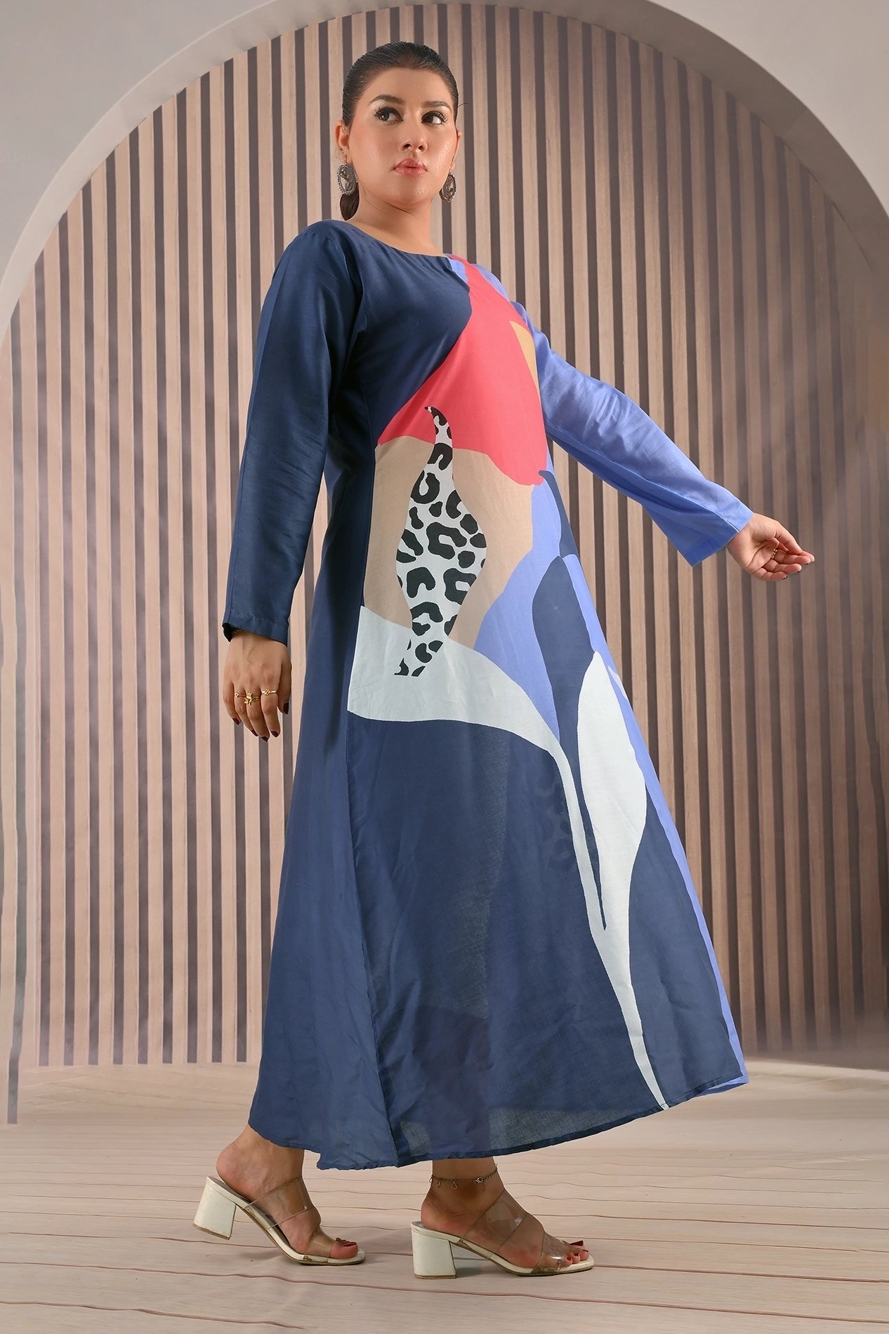 Side view of BOLDSTEP cotton maxi dress featuring a bold mix of navy, coral, beige, and animal print patterns, styled with block heels | BOLD STEP | BOLDSTEP.PK | BOLDSTEP STORE.