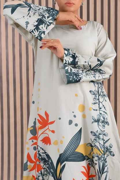 Close-up view of BOLDSTEP floral printed maxi dress showing elegant botanical patterns in orange, yellow, and teal blue with soft ivory base and printed sleeve cuffs | BOLD STEP | BOLDSTEP.PK | BOLDSTEP STORE.