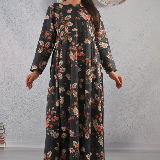 BOLDSTEP product video featuring a black floral printed cotton maxi dress with beige and red flower patterns. The model showcases the soft flare, long sleeves, and elegant fall of the dress in natural studio lighting — a timeless floral design from BOLD STEP | BOLDSTEP.PK | BOLDSTEP STORE.