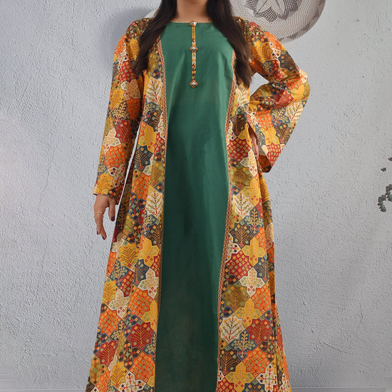 BOLDSTEP product video showcasing a long ethnic-print cotton maxi dress with a solid green inner and colorful multi-pattern outer jacket. The model walks and poses gracefully, highlighting the detailed prints, flowy fabric, and statement neckline — a premium handcrafted outfit from BOLD STEP | BOLDSTEP.PK | BOLDSTEP STORE.