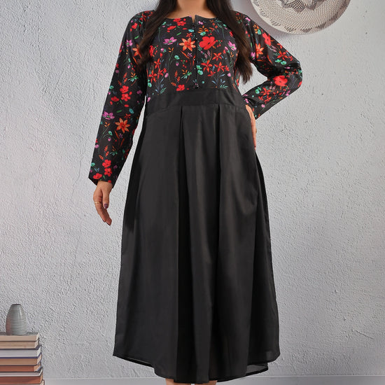 BOLDSTEP product video featuring a black cotton maxi dress with a colorful floral printed bodice and plain pleated skirt. The model showcases the front, back, and side angles, highlighting the elegant flow, soft fabric, and vibrant floral design – premium women's fashion from BOLD STEP | BOLDSTEP.PK | BOLDSTEP STORE.