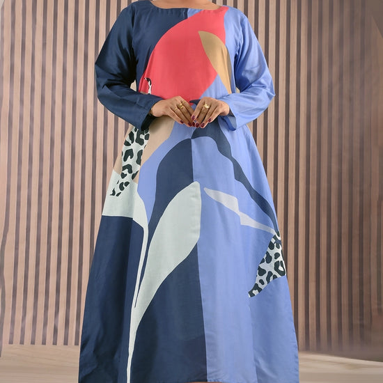 BOLDSTEP product video showcasing a modern abstract printed maxi dress with bold navy blue, coral red, beige, and light blue geometric patterns. The model gracefully walks to highlight the flowy A-line silhouette, long sleeves, and premium stitched cotton fabric — reflecting BOLDSTEP’s signature contemporary style | BOLD STEP | BOLDSTEP.PK | BOLDSTEP STORE.